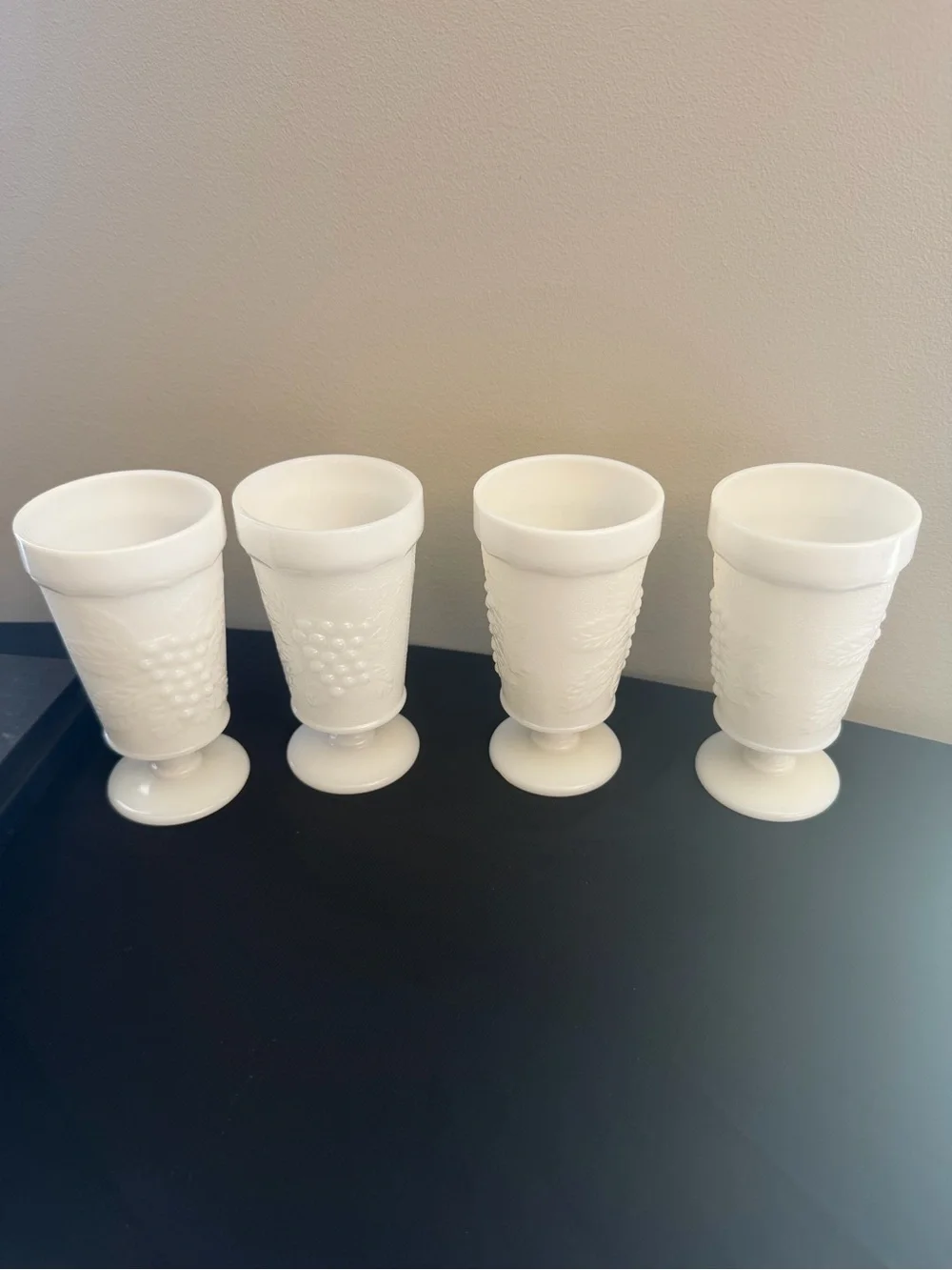 Vintage footed milk glass goblet cups with grapes and vine design